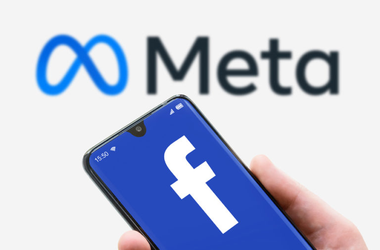 Facebook Logo On Screen Of Mobile Phone On Meta Word Background.