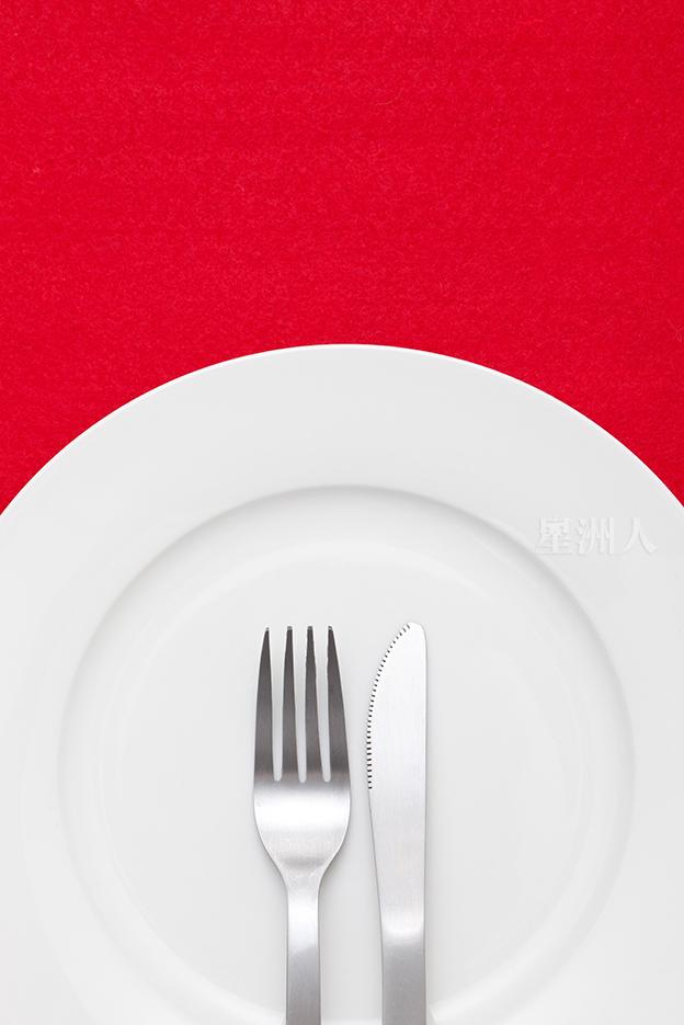 White Empty Plate With Fork And Knife On Red Tablecloth