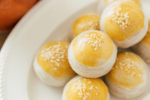 Chinese flaky pastry or mooncake filled sweet mung bean paste an