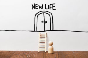 Concept Of A New Life With A Person In Front Of A Staircase And A Door Abstract
