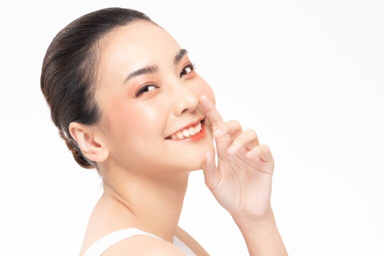 Beauty asian women  touching nose  skin care healthy and skin.