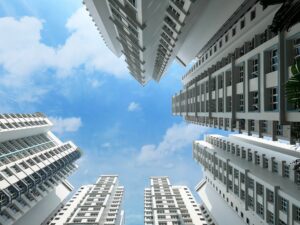Residential Apartment Hdb Flat Blocks Under Cloudy Blue Sky In Singapore
