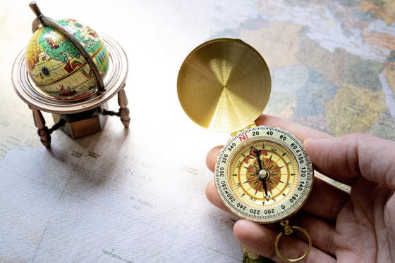World map and compass